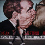 East Side Gallery with ‘Brotherly Kiss’ graffiti on the Berlin Wall.