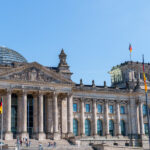 Reichstag building with glass dome and the inscription ‘To the German People’.